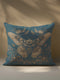 Decorative pillow cover featuring a large golden moth or butterfly design with detailed wings, surrounded by floral motifs and botanicals, printed on a deep teal blue linen fabric background.